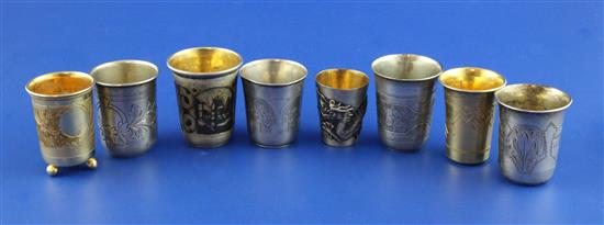 Eight assorted 19th century and later Russian 84 zolotnik silver and silver gilt vodka tots, 2in et infra.